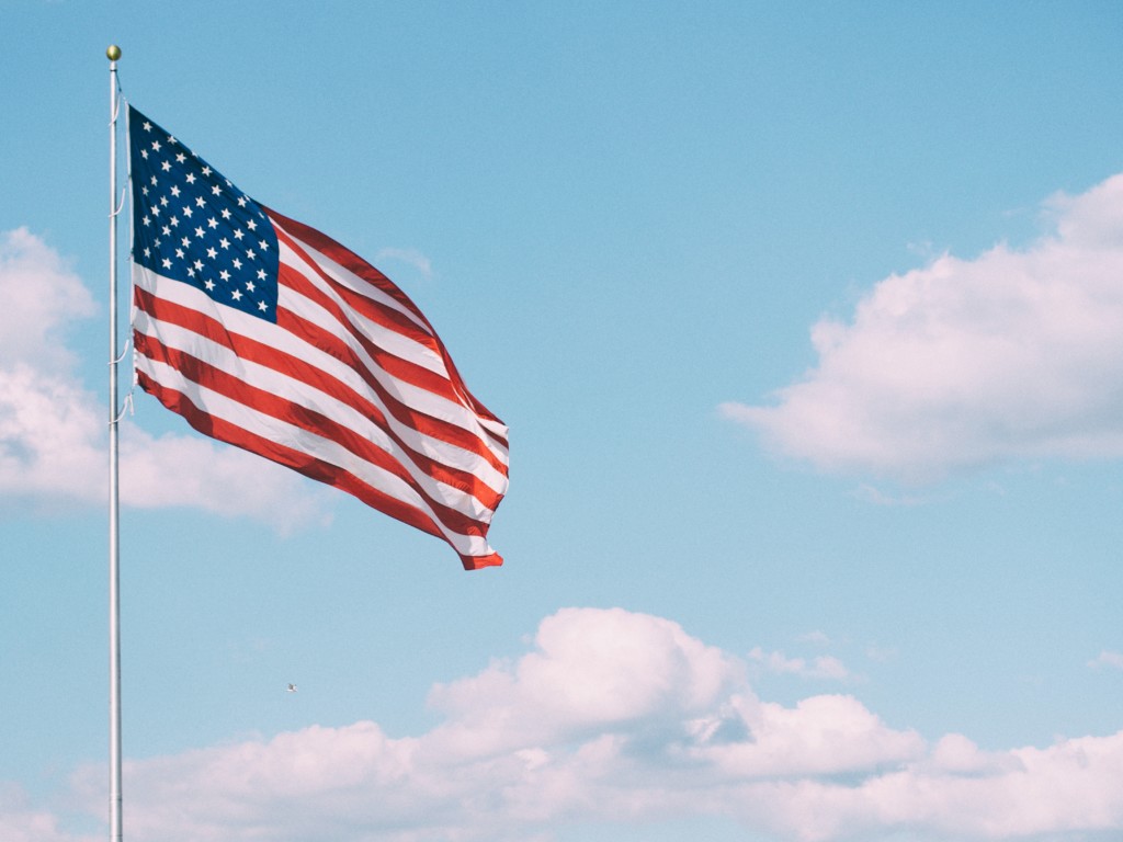 American flag against a blue sky Providence Moms Blog