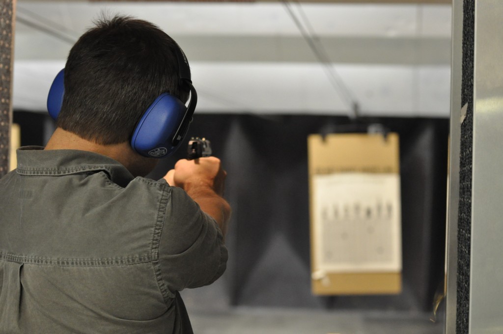 man shooting gun at target Providence Moms Blog