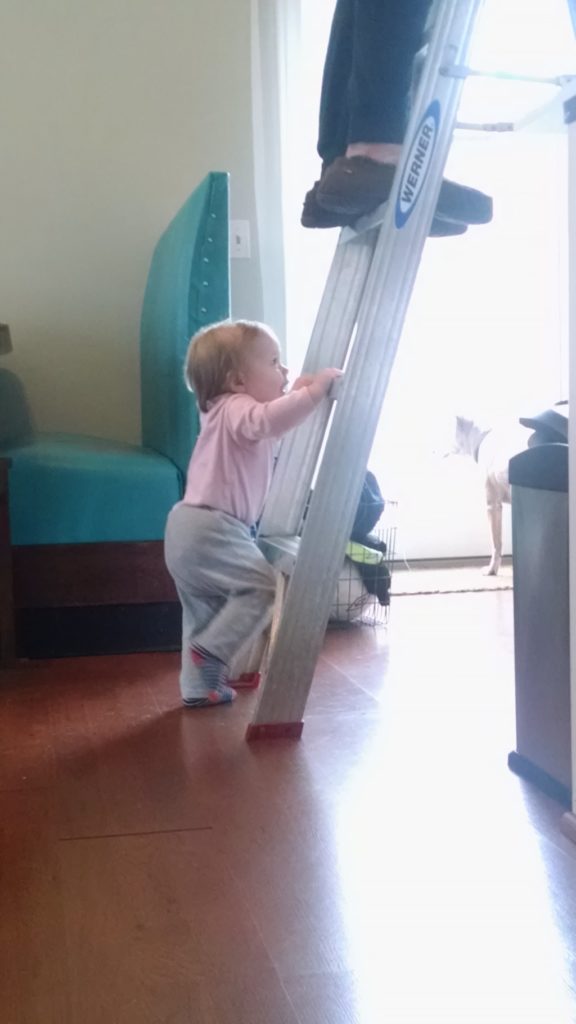 Toddler standing near ladder Providence Moms Blog