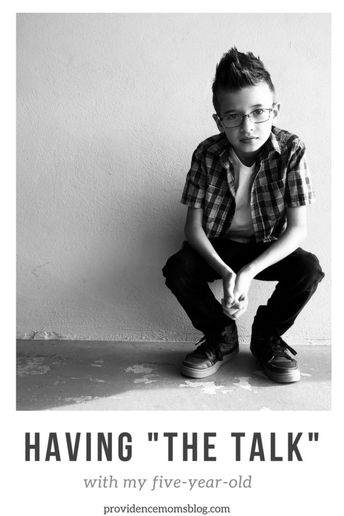 boy crouching down against wall Providence Moms Blog