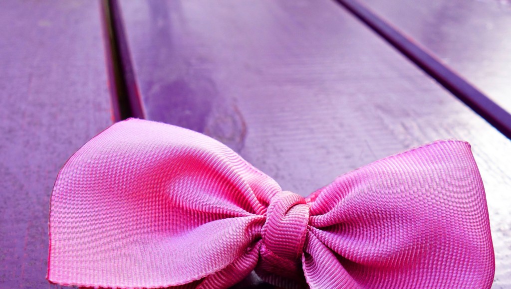 Pink Bow on Purple Background in Providence Rhode Island Moms Blog Organizing Blog Post