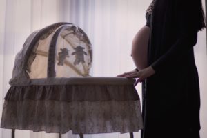 pregnant woman with bassinet Providence Moms Blog