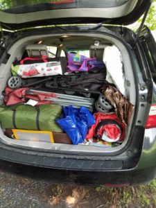 trunk of car packed with luggage Providence Moms Blog