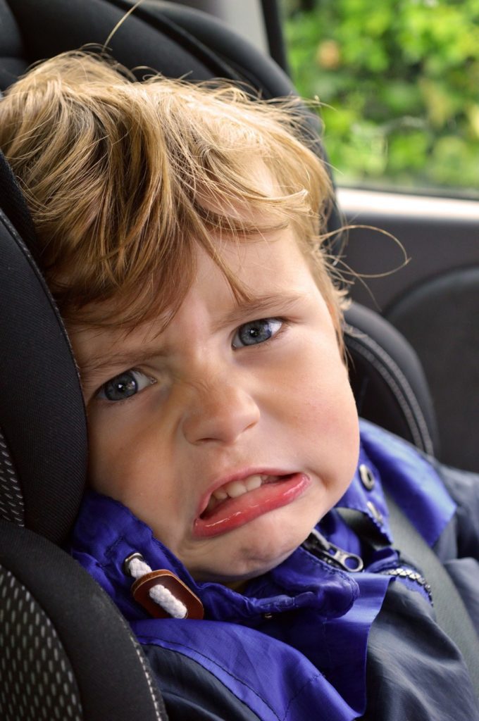 boy sitting in car seat Providence Moms Blog