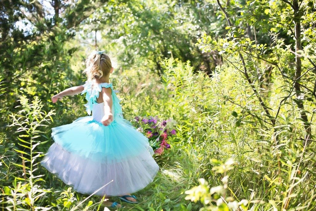 girl pretending to be princess in the woods Providence Moms Blog