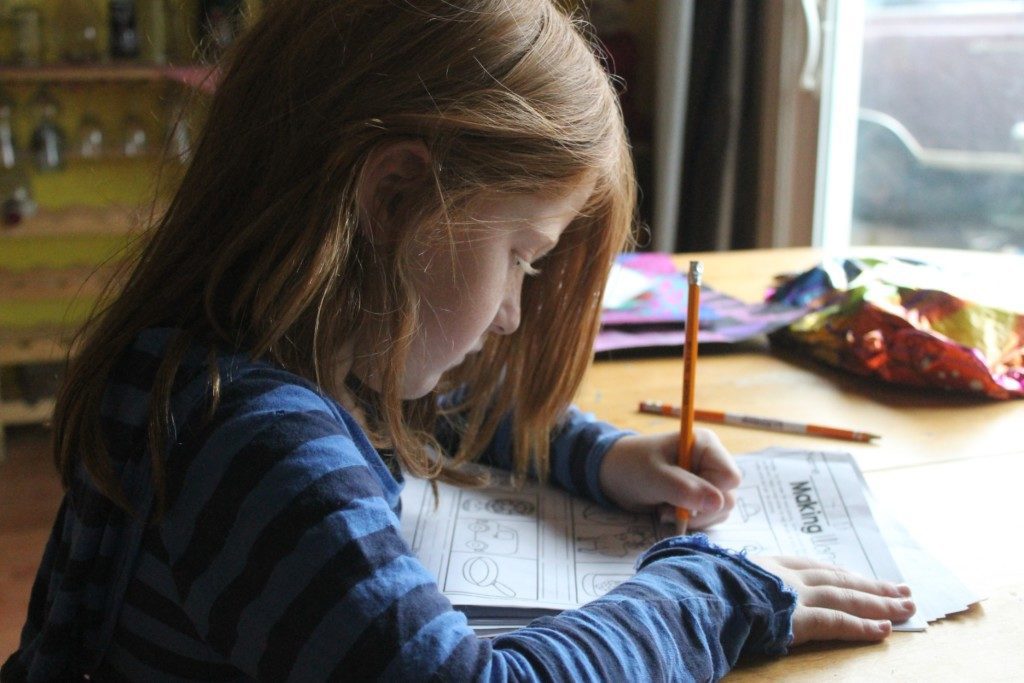 girl doing homework Providence Moms Blog