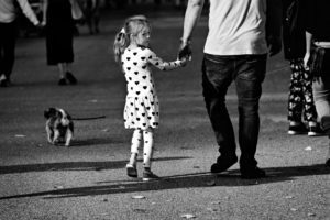 daughter holding hands with father Providence Moms Blog