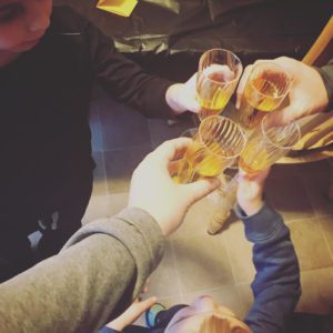 Noon year's eve toast of apple juice in plastic champagne flutes