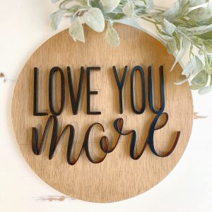 scrolled sign with words love you more
