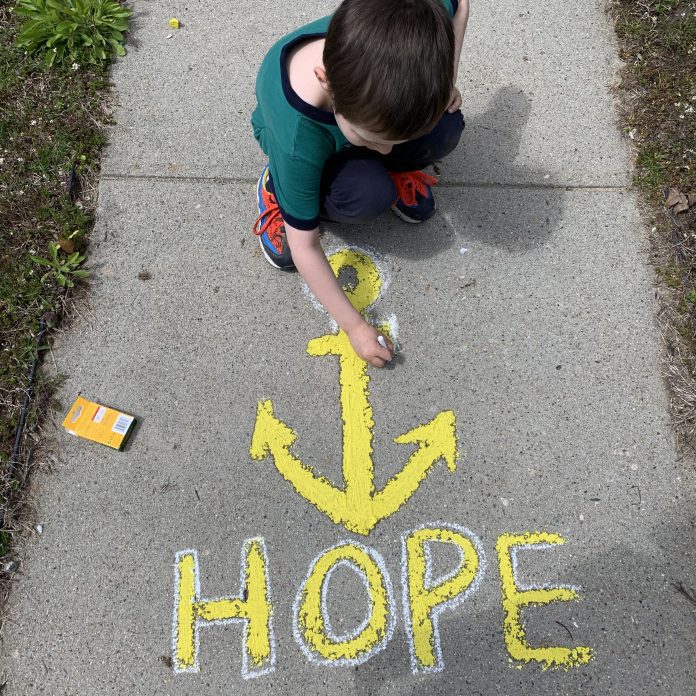 hope in chalk on sidewalk share a smile