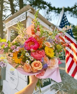 Flower bouquet in front of a farm stand